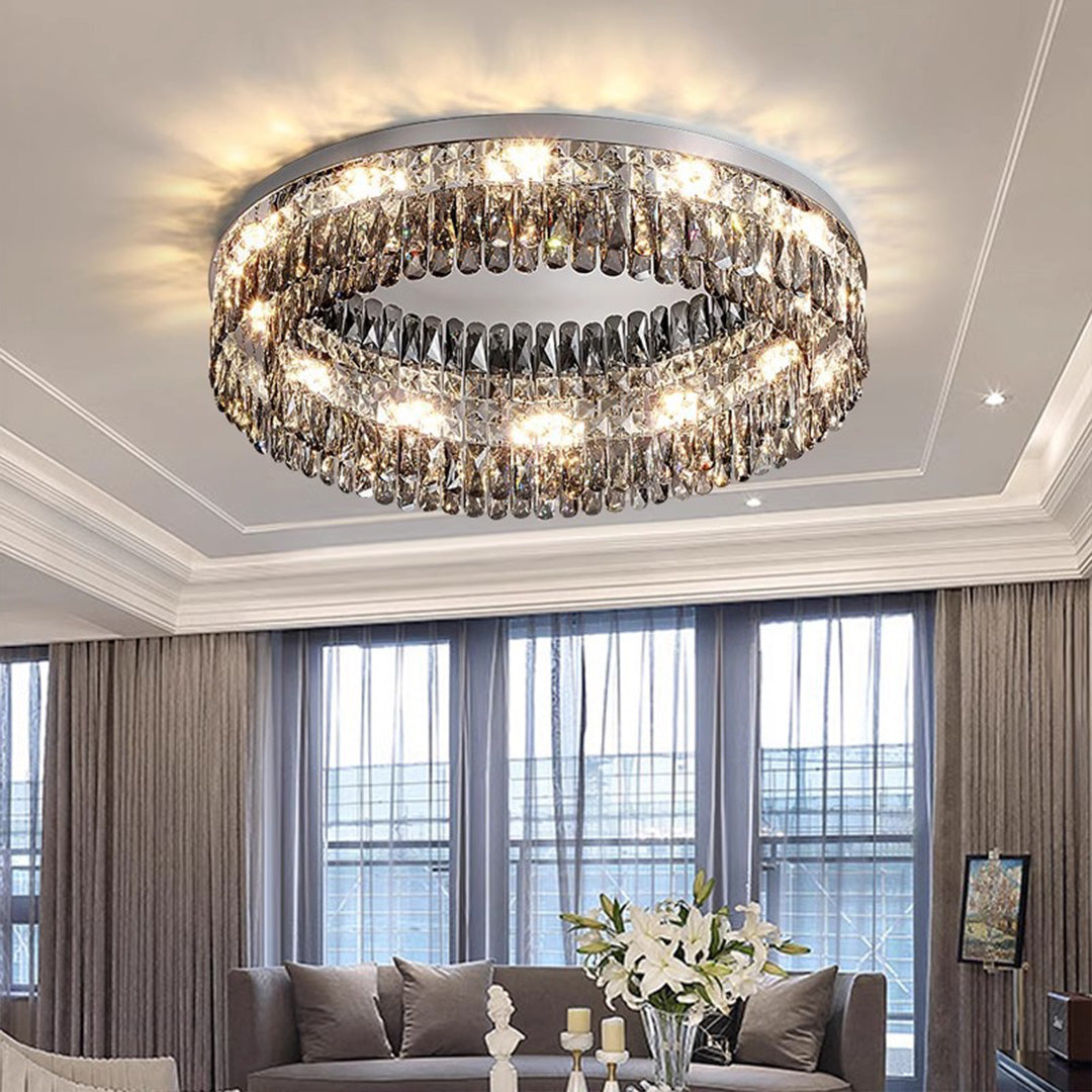 Spacious living area interior with beautiful ceiling round led lights crystal chandelier illuminating the space