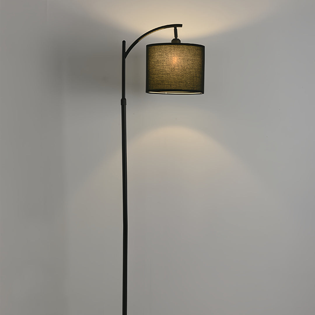 Stylish interior showcasing small black pendant light with dark fabric drum shade and sleek arc construction