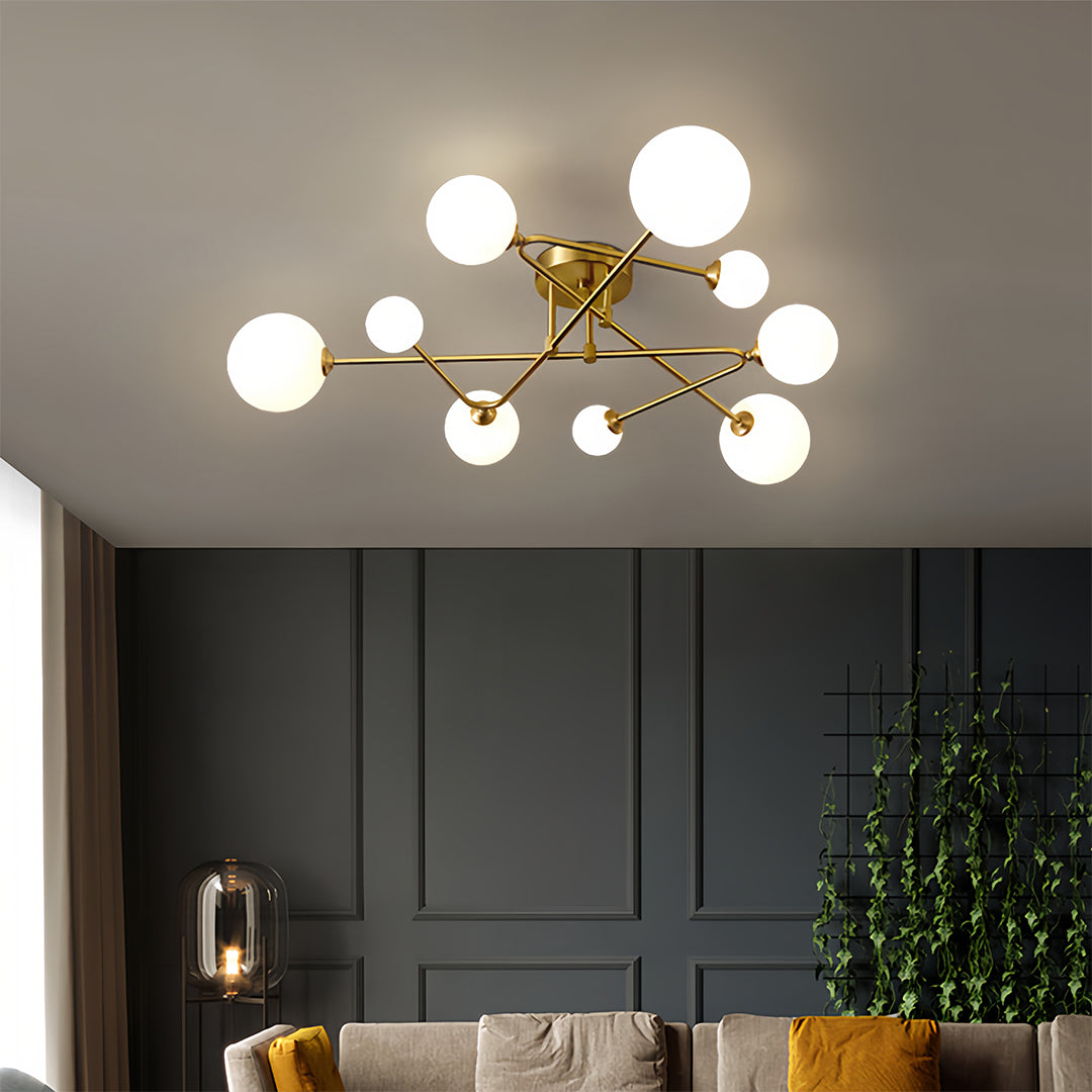 Contemporary interior showcasing gold semi flush mount light with globe bulbs and clean geometric lines