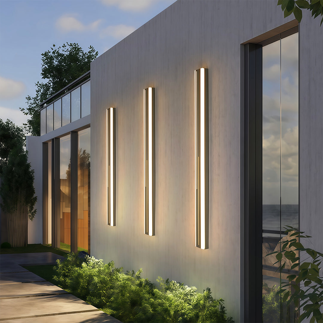 Interior outdoor wall mount lighting beside staircase providing ambient architectural illumination