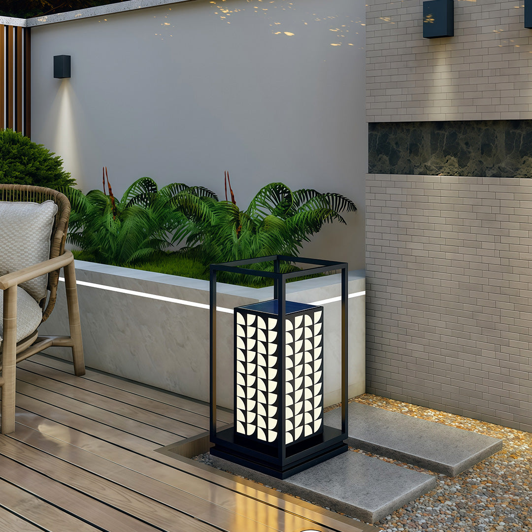 LED bollard light designed with intricate leaf patterns, providing soft illumination for outdoor landscapes.