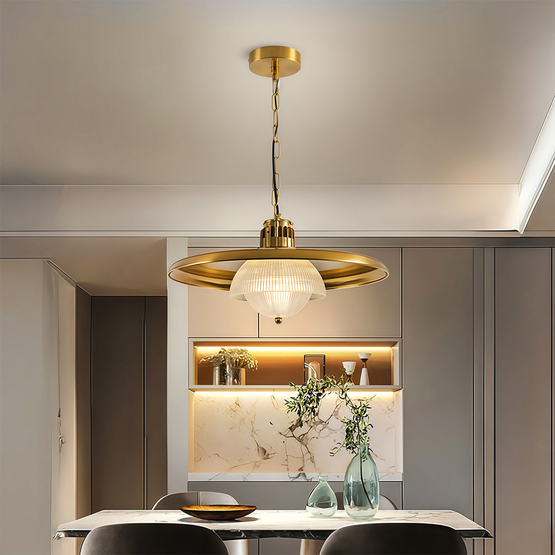 Iron pendant light fixture installed above kitchen island providing elegant ambient lighting in modern space