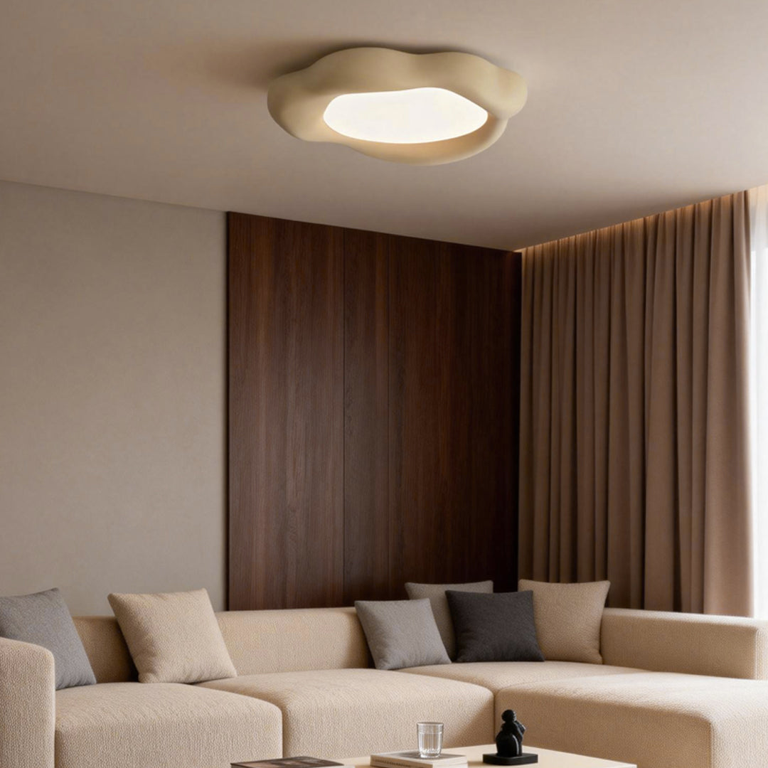 Sleek irregular ceiling light with a warm glow, perfectly complementing a modern living room with wooden accents.