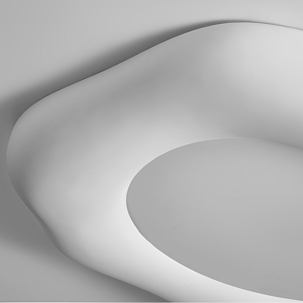 Close-up view of a white irregular ceiling light showcasing its unique and organic shape.