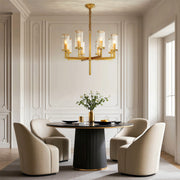 Island chandelier modern creating focal point in contemporary dining space with brass accents