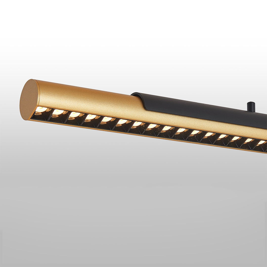 Close-up view of island linear pendant lighting showing refined metal texture and detailed craftsmanship.