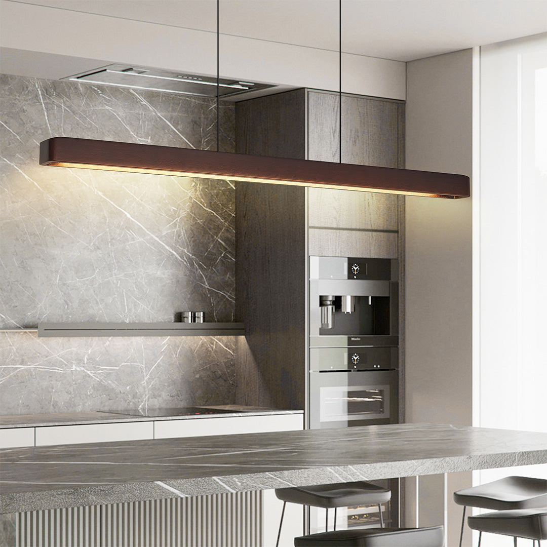 Minimalist dining area with linear LED pendant lighting, offering soft light for a cozy atmosphere.