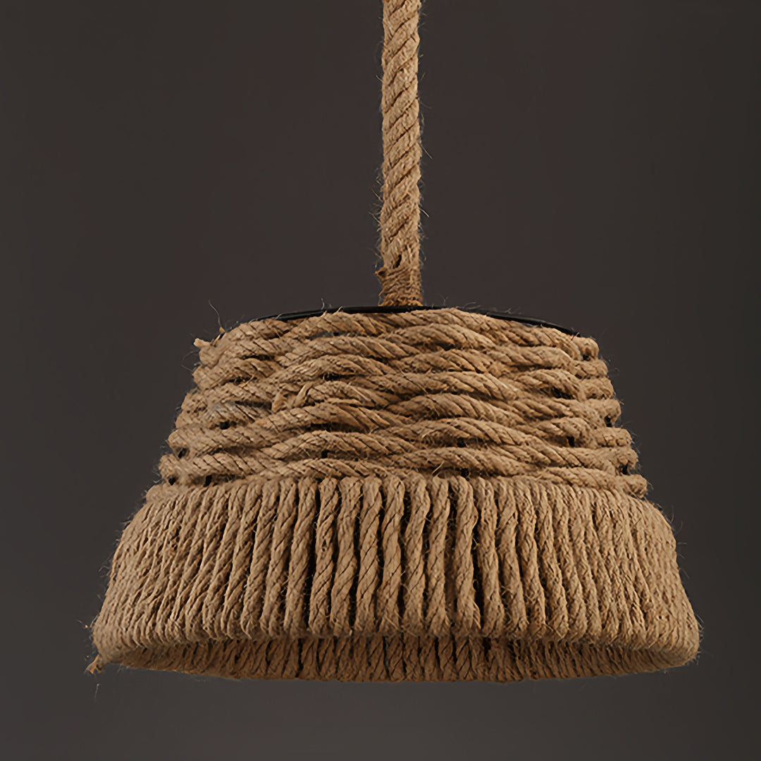 Isolated view of the basket-style rope pendant lights showcasing the tiered fringe design and thick hanging cord.