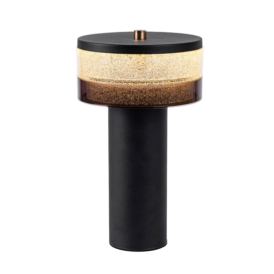 Isolated view of the black base cylindrical table lamp highlighting the decorative, textured gold light panel.