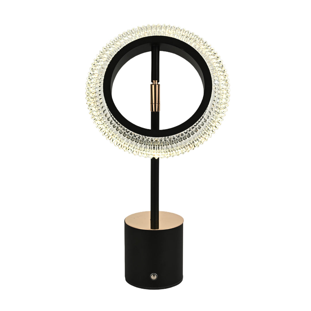 Isolated black ring table lamp with gold base and copper center bar, highlighting the crystalline shade design.