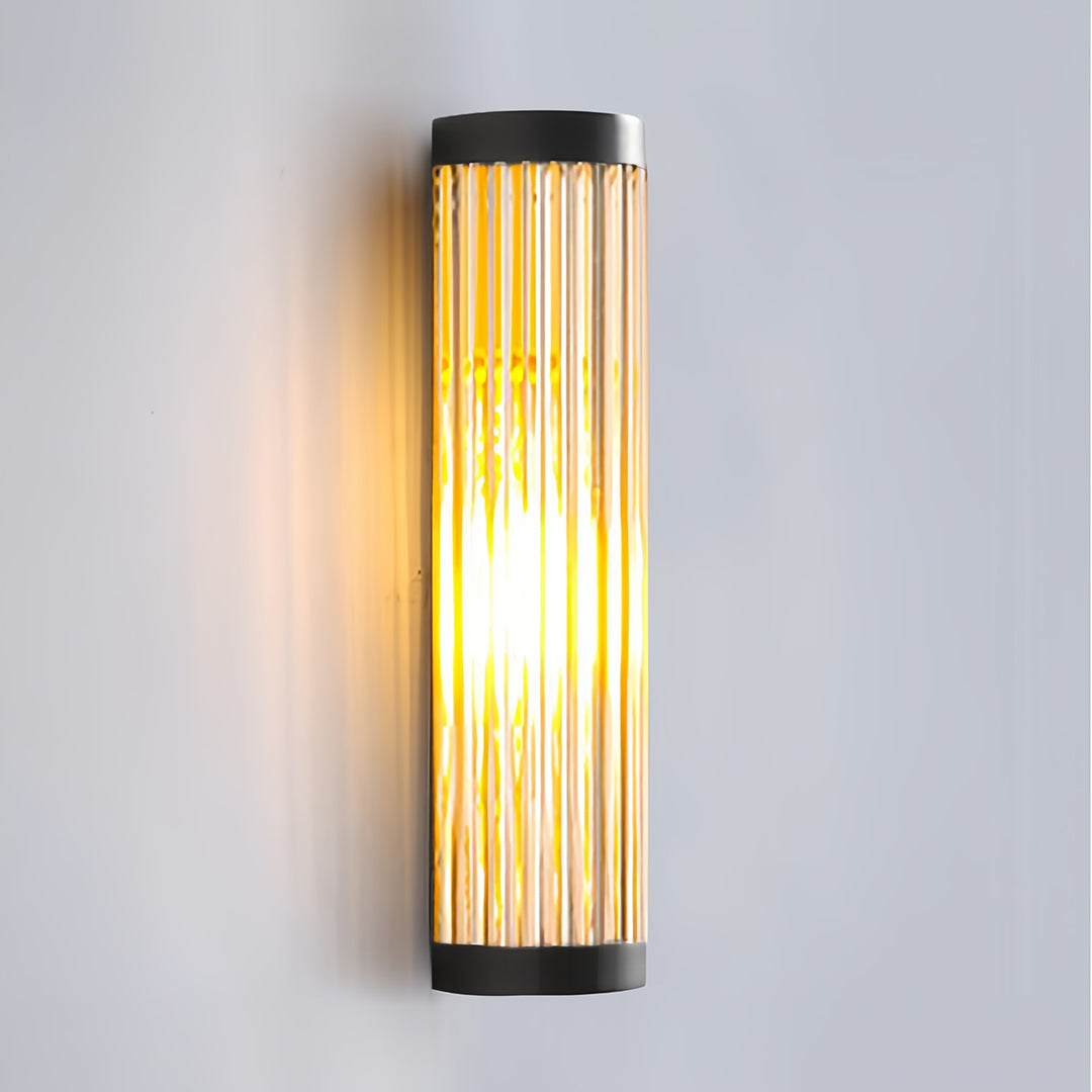 Isolated product shot of the long, clear-ribbed acrylic and black metal outdoor wall LED light fixture.