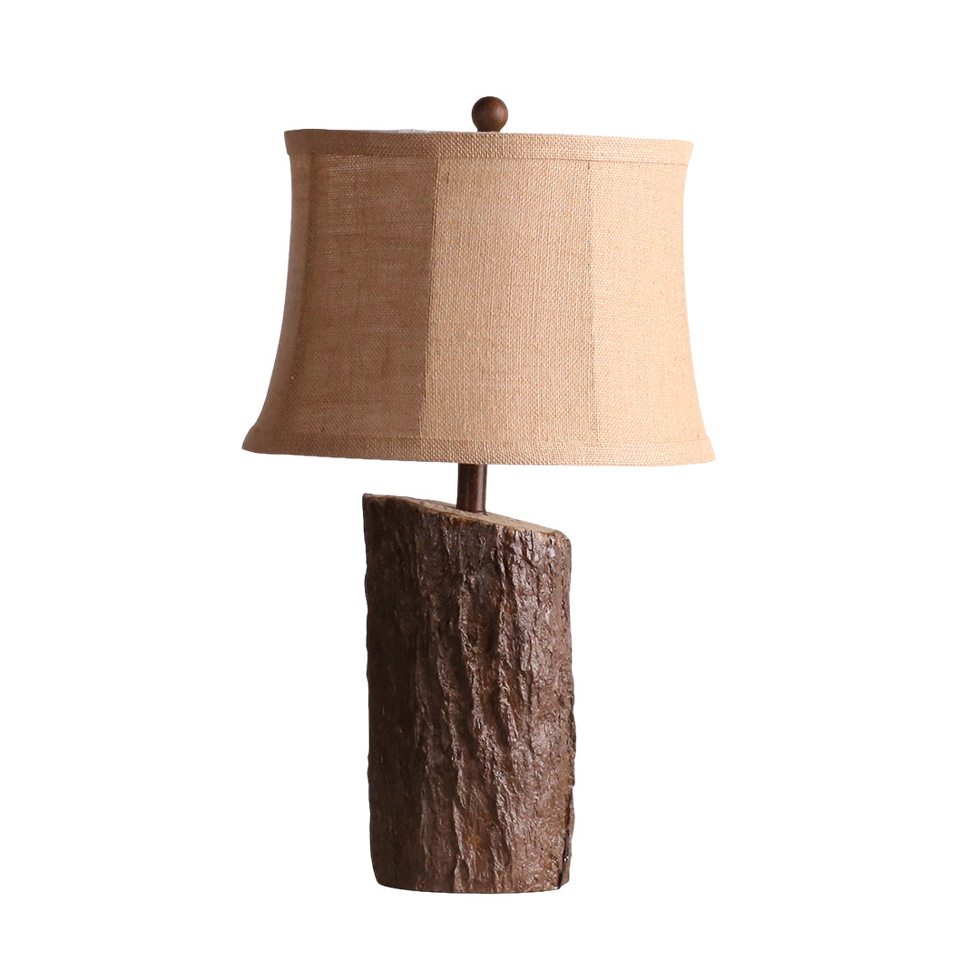 Isolated product view of the faux wood table lamp, showing the distressed, dark brown wood-grain texture of the base.