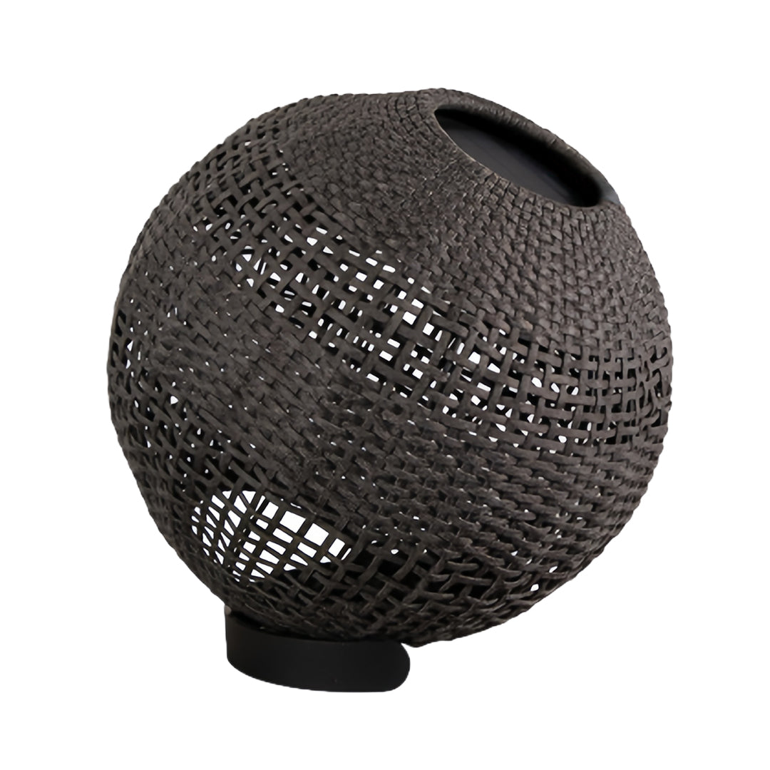 Isolated close-up of the outdoor globe lantern, showcasing the dense, dark brown hand-woven resin material and the top opening.