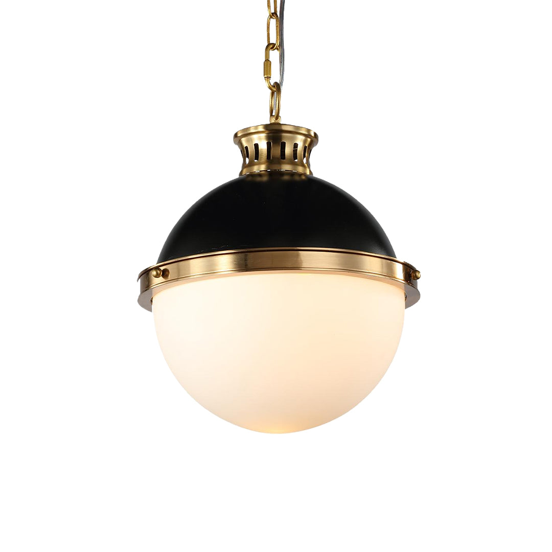 Isolated close-up of the ball pendant light, featuring a high-gloss black metal cap and sleek brass band accents.