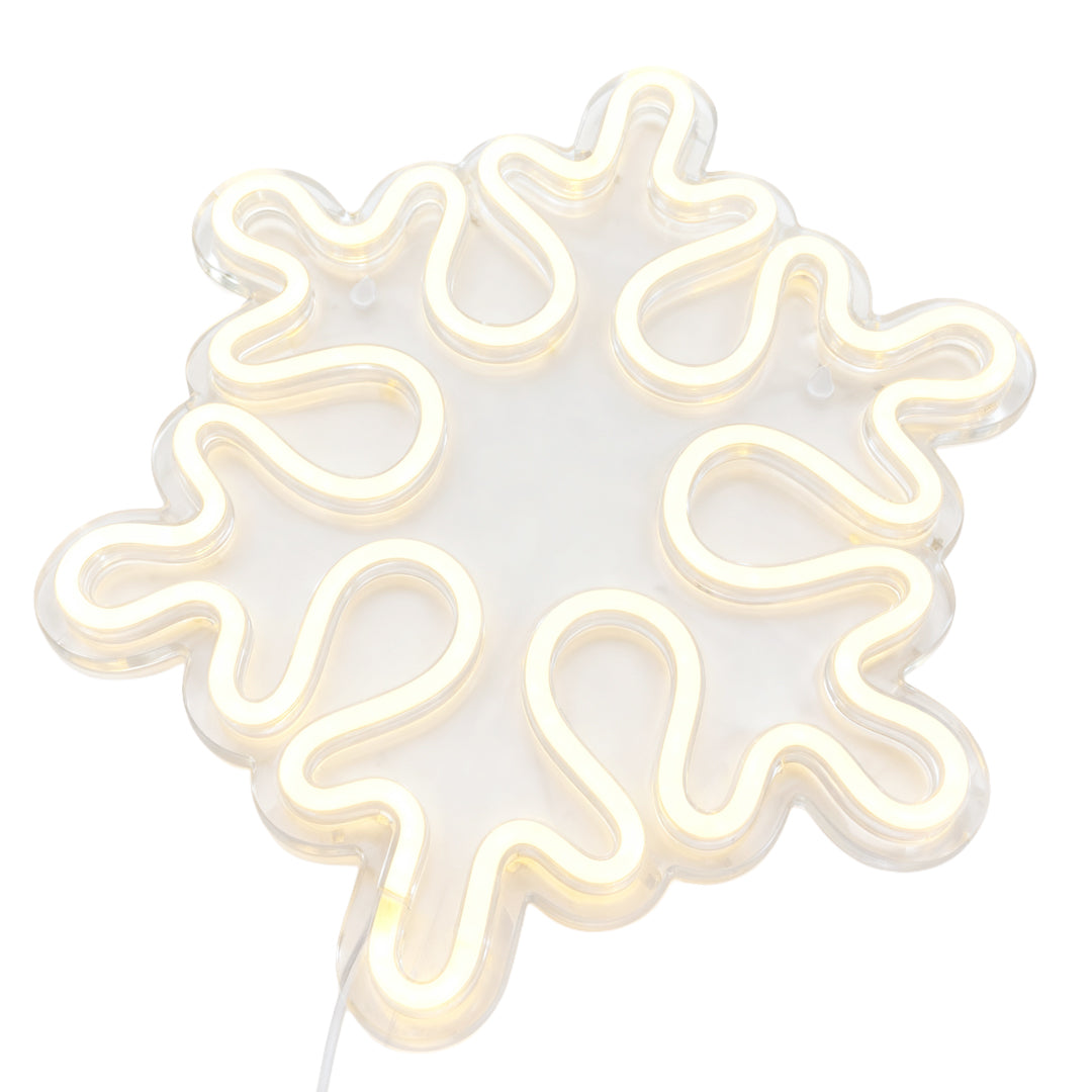 Isolated view of the irregular snowflake LED light, packaged with halloween neon lights for mixed holiday sets.