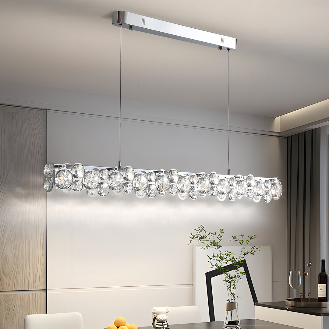 Isolated product view of the sleek silver pendant light with a minimalist canopy and adjustable suspension cables.