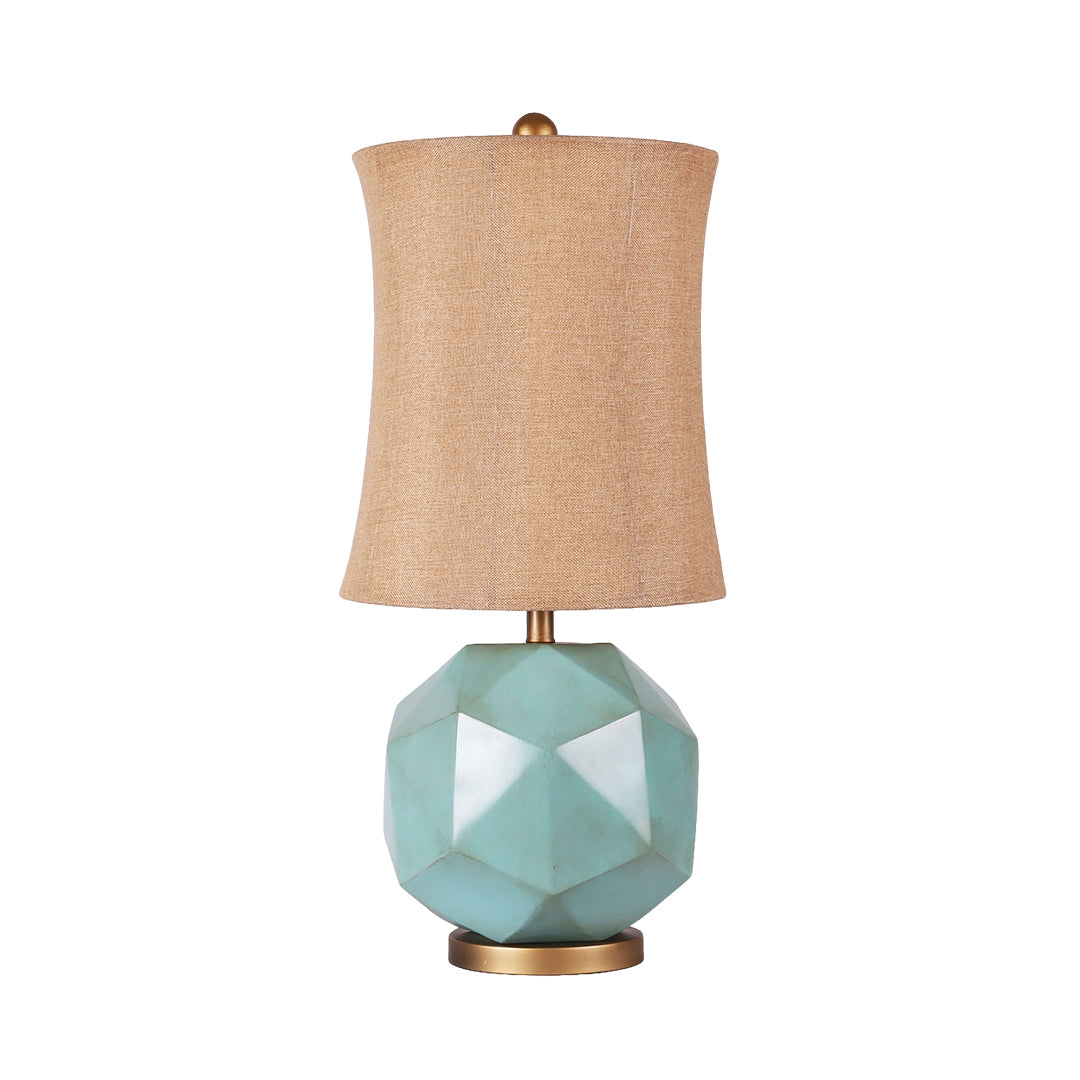 Isolated product view of the modern industrial table lamps, showing the teal geometric base, gold trim, and beige shade.