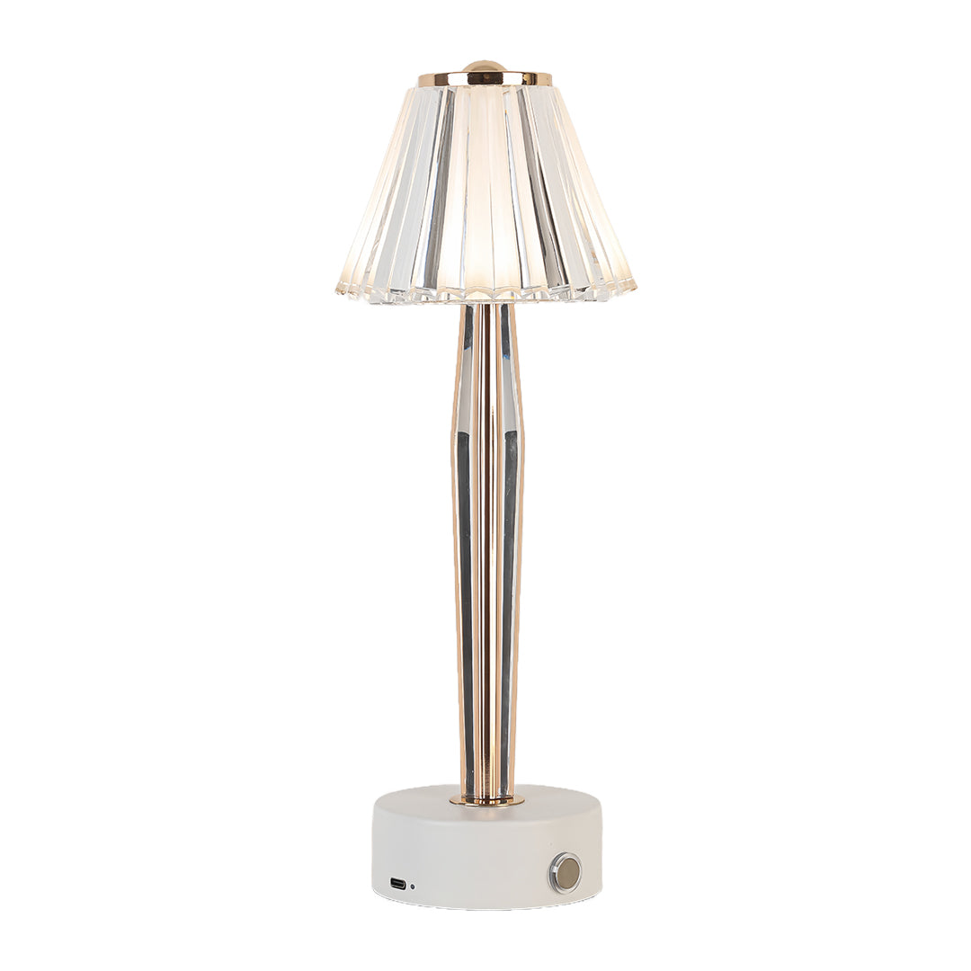Isolated white base classic table lamp showcasing its ribbed glass shade and elegant gold-finished body.