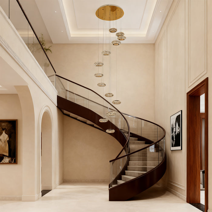 Italian style chandelier hanging above a spiral staircase, providing sophisticated illumination.
