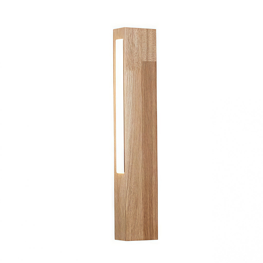 Minimalist Japanese wall light with a light wood vertical panel, used as modern accent lighting above a desk setup. 
