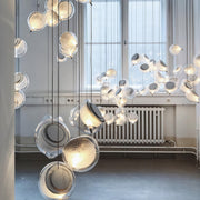 Nordic luxury jellyfish pendant light crafted from glass, creating a soft ambient glow and an artistic focal point for modern interiors.