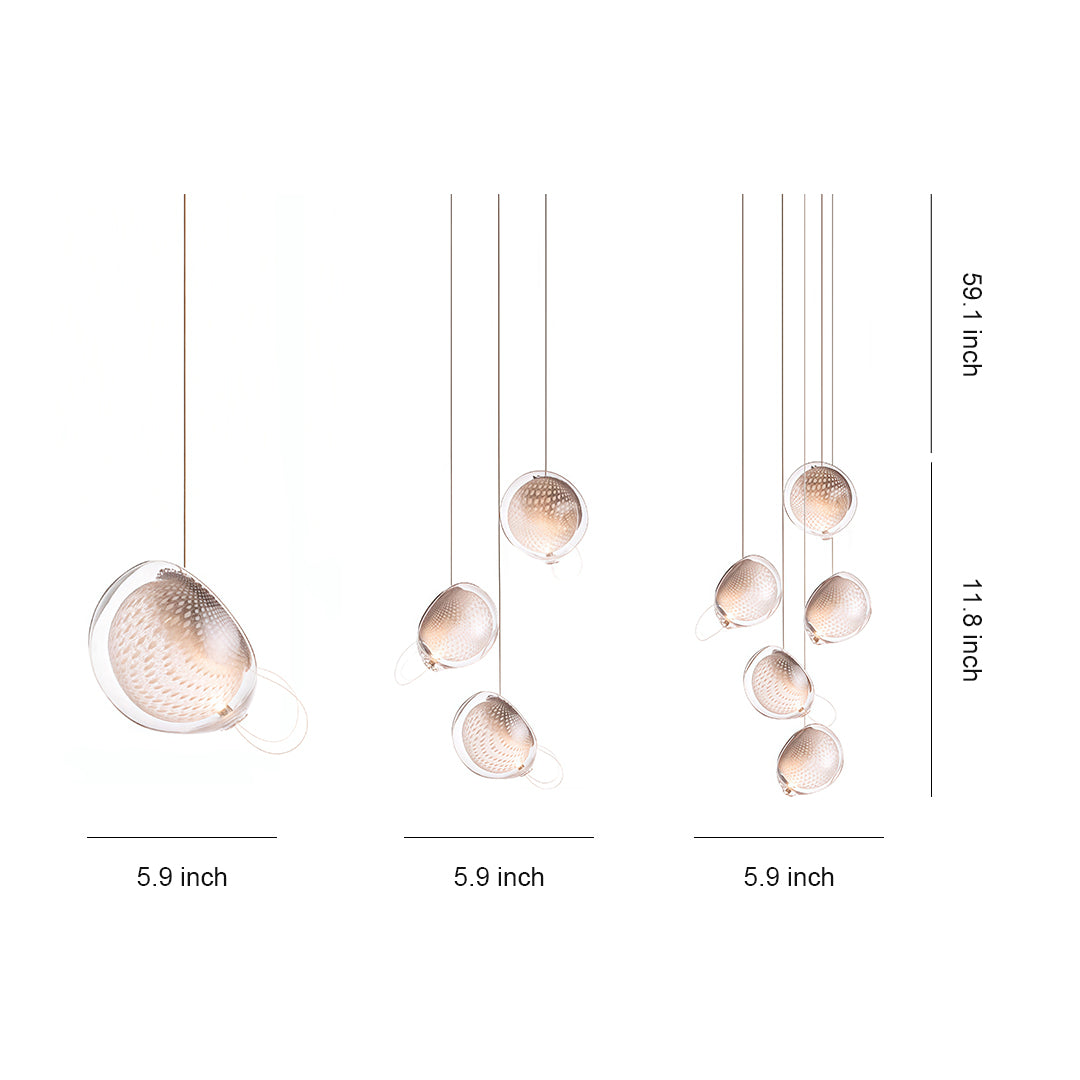 Modern jellyfish pendant light with artistic glass sphere and brass suspension.