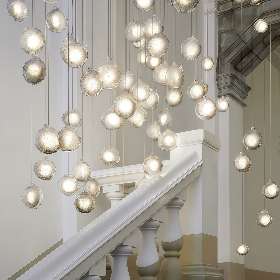 This jellyfish pendant light features elegant glass design with nordic style, adding refined luxury and warm illumination to any space.