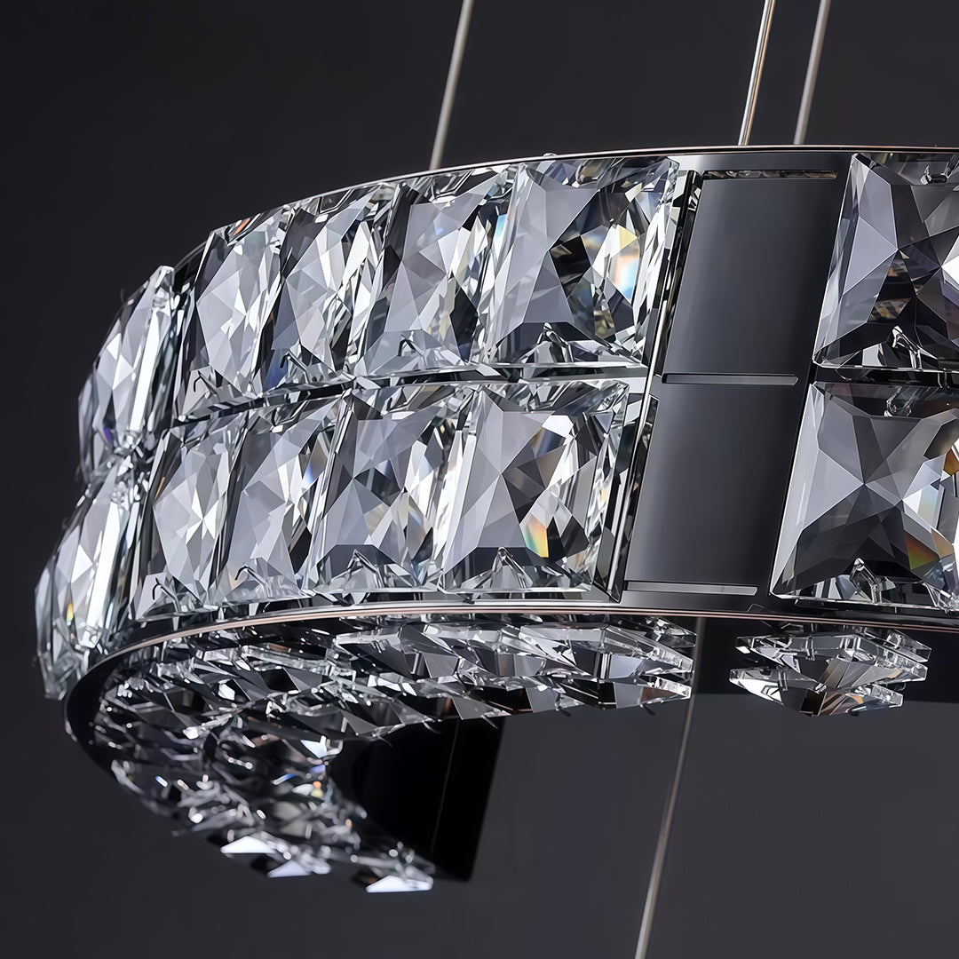 Ceiling mount plate of a K9 crystal chandelier with hanging wires.