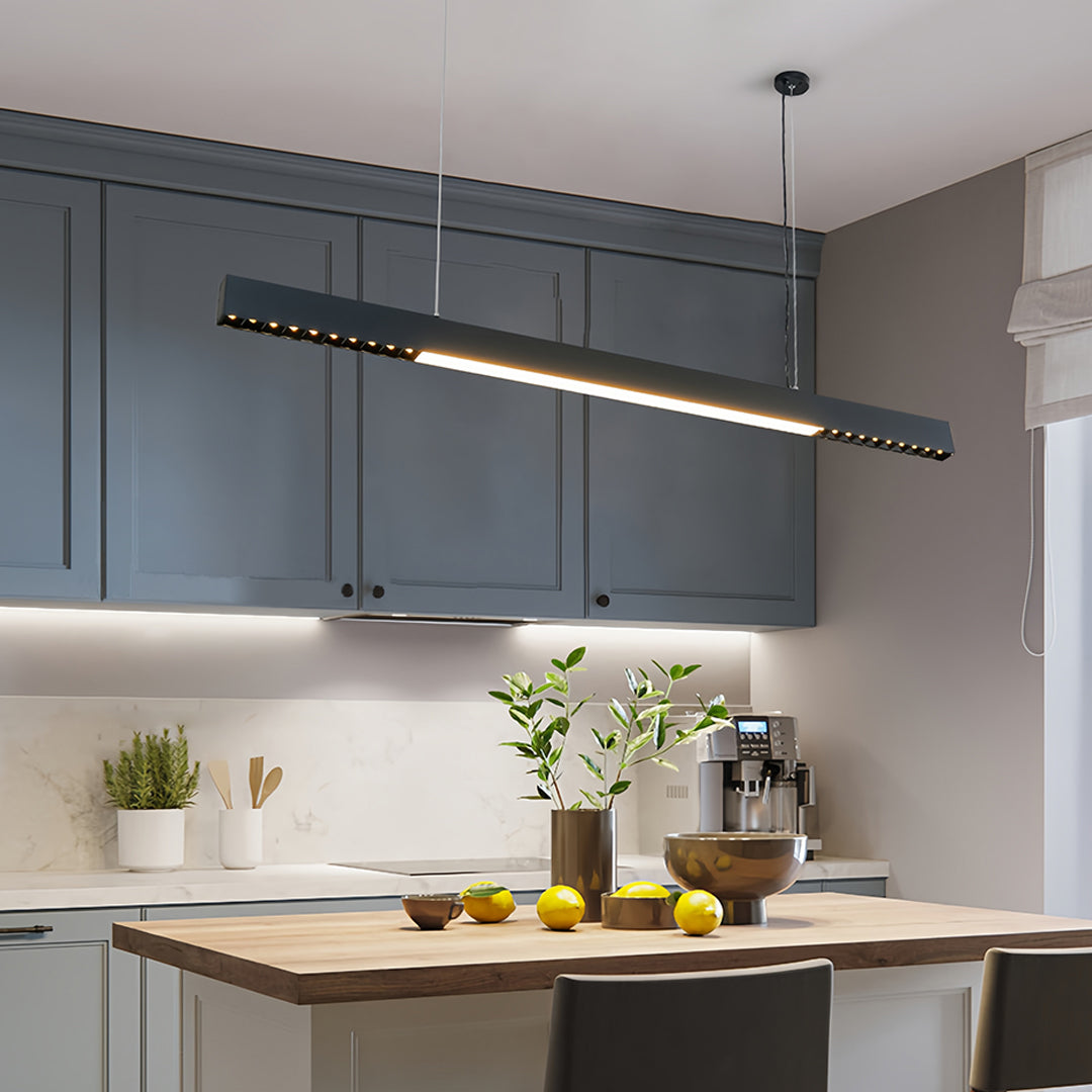Kitchen island showcasing black linear light pendant for functional task and accent lighting
