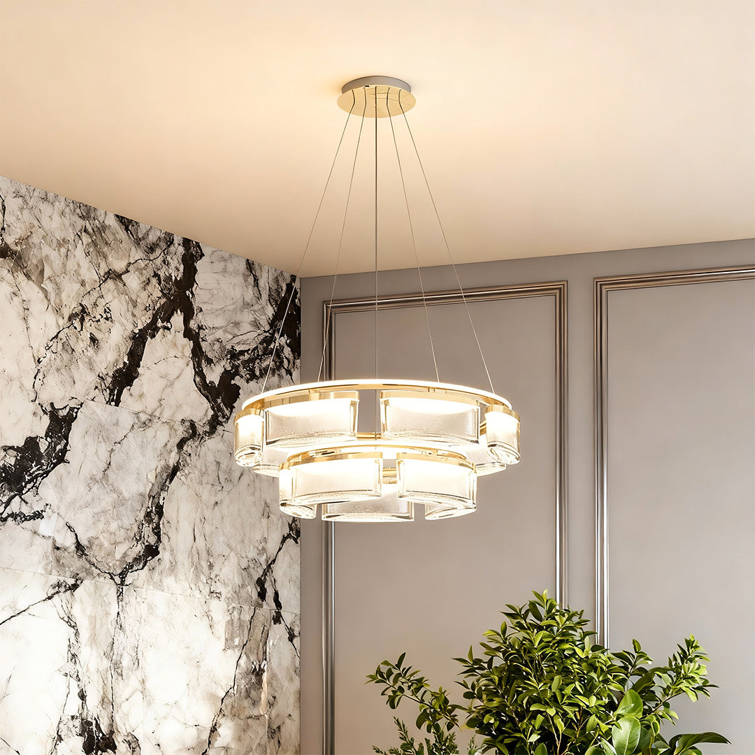 Kitchen island chandelier modern creating focal point in contemporary living space with marble wall and botanical decor