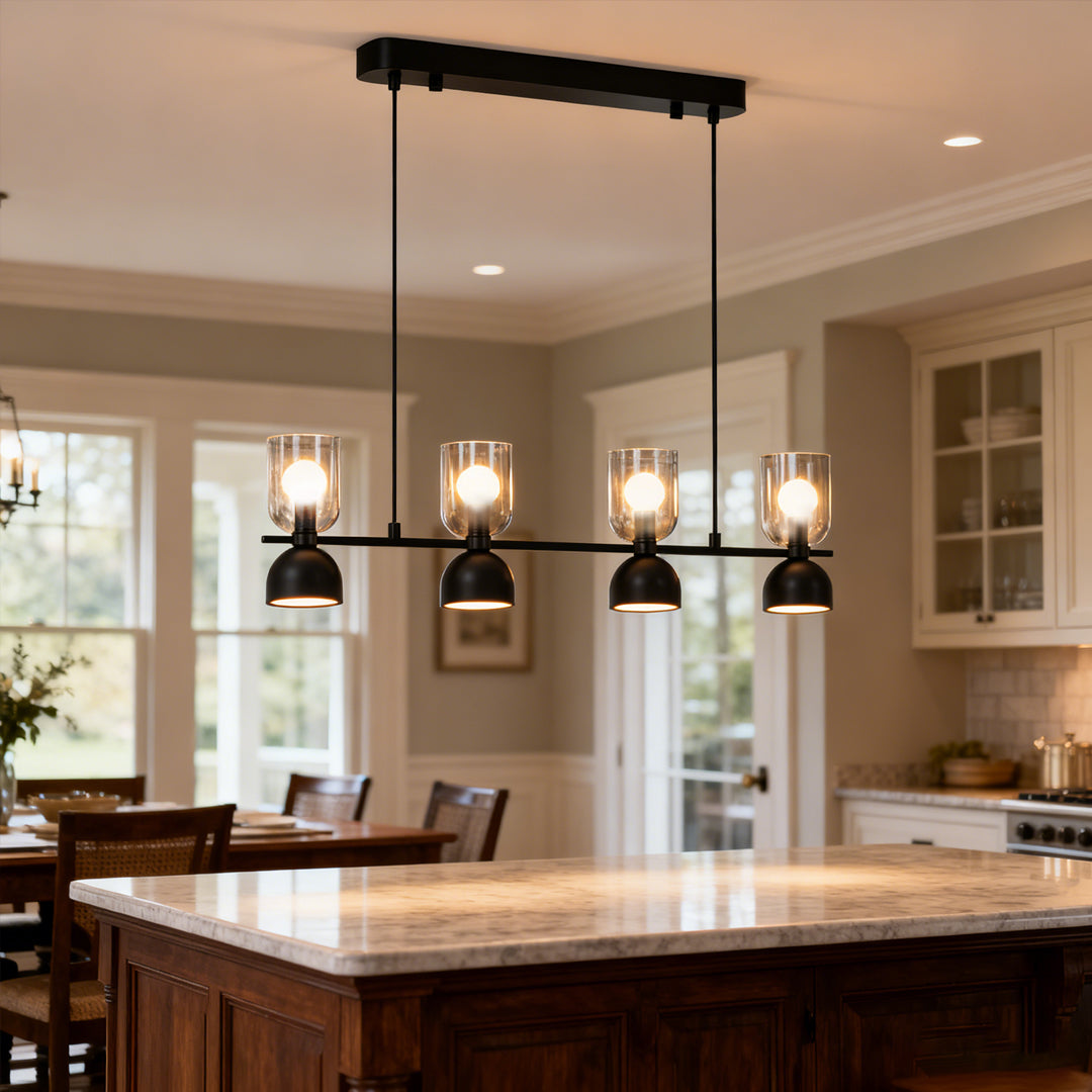 Modern kitchen island glass pendant chandelier with warm glowing bulbs and industrial black finish.