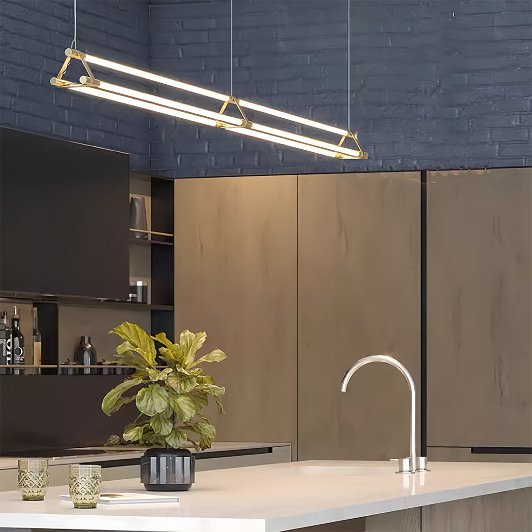Kitchen linear pendant lights with sleek profile providing task lighting over modern island workspace