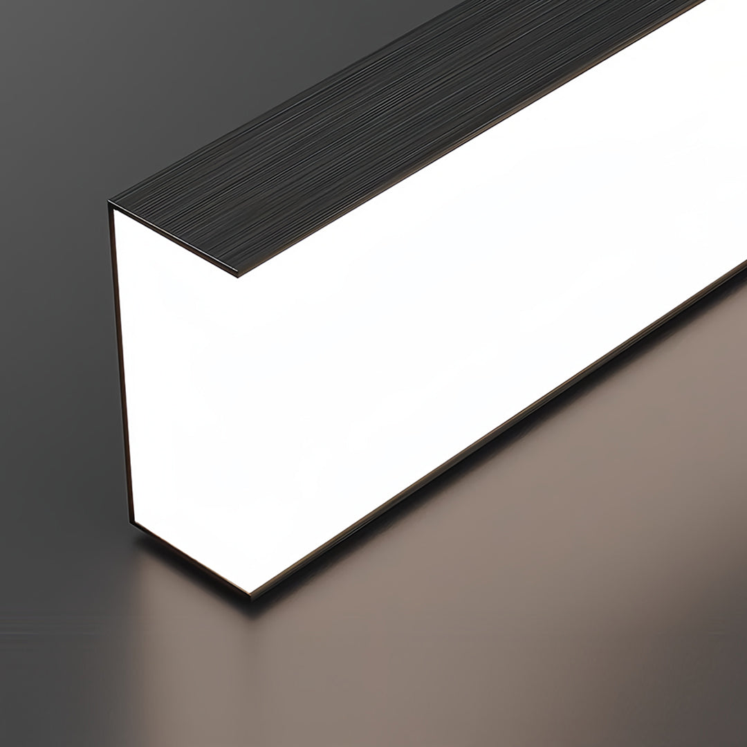 Modern kitchen featuring small black pendant light above sleek marble island