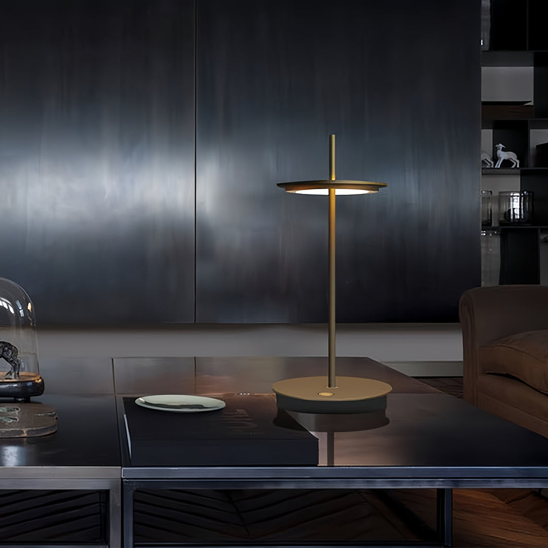 Modern dimmable table lamp providing task lighting in sleek kitchen with dark cabinetry