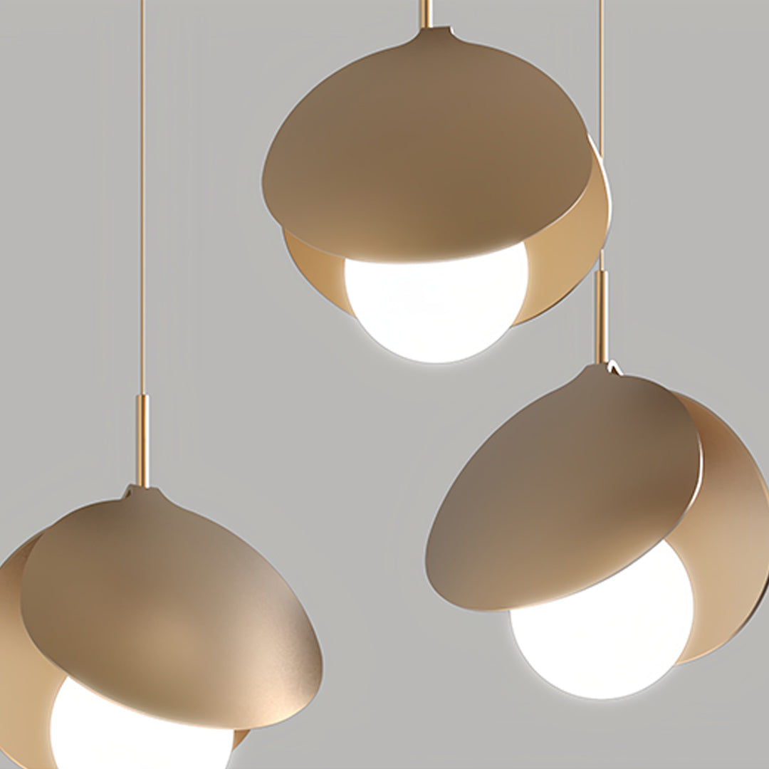 Modern kitchen featuring multiple 3 bulb pendant lights with dome shades for island lighting