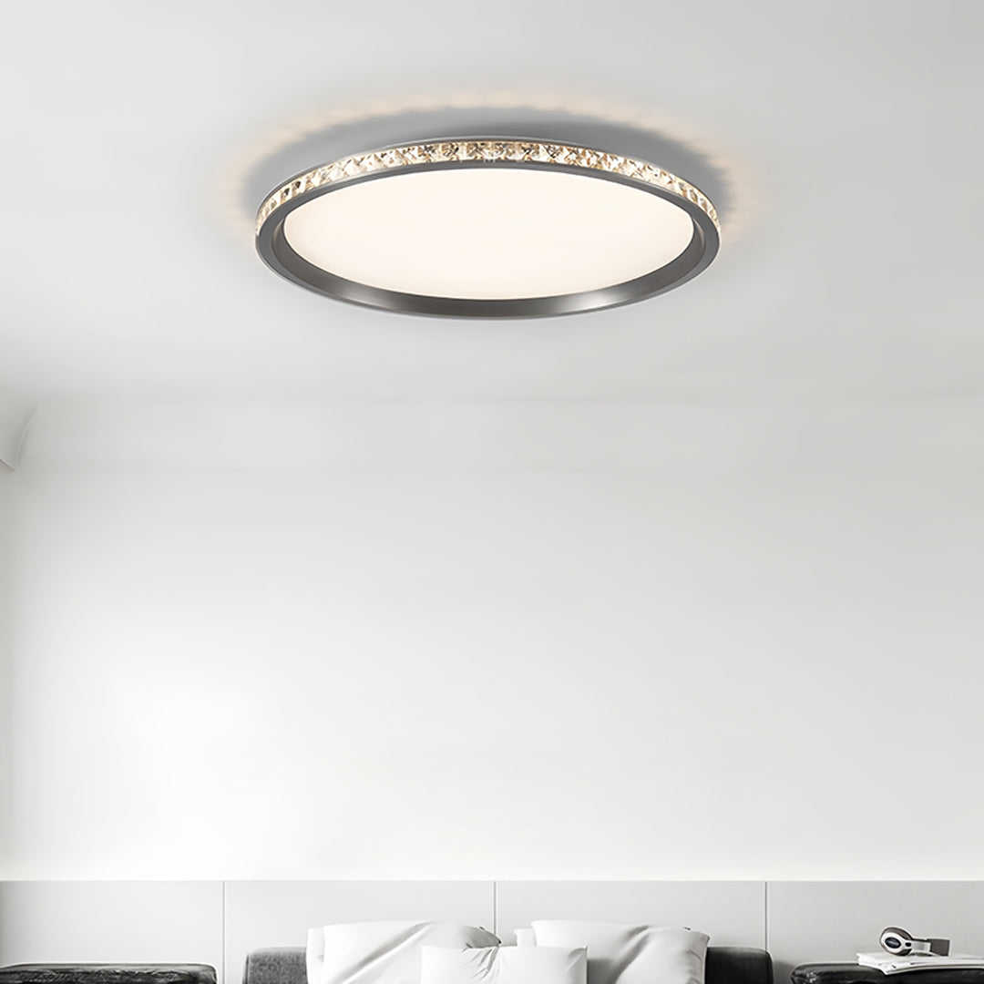 Round flush mount LED light installed in modern kitchen providing bright task lighting