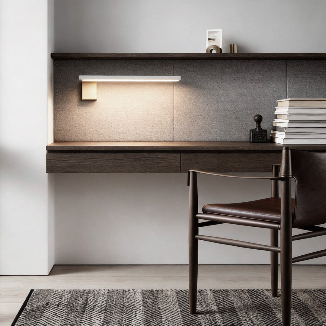 L shape wall light used as task lighting above a minimalist desk.
