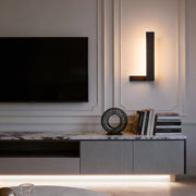 L shape wall light installed in a modern living room with ambient lighting.