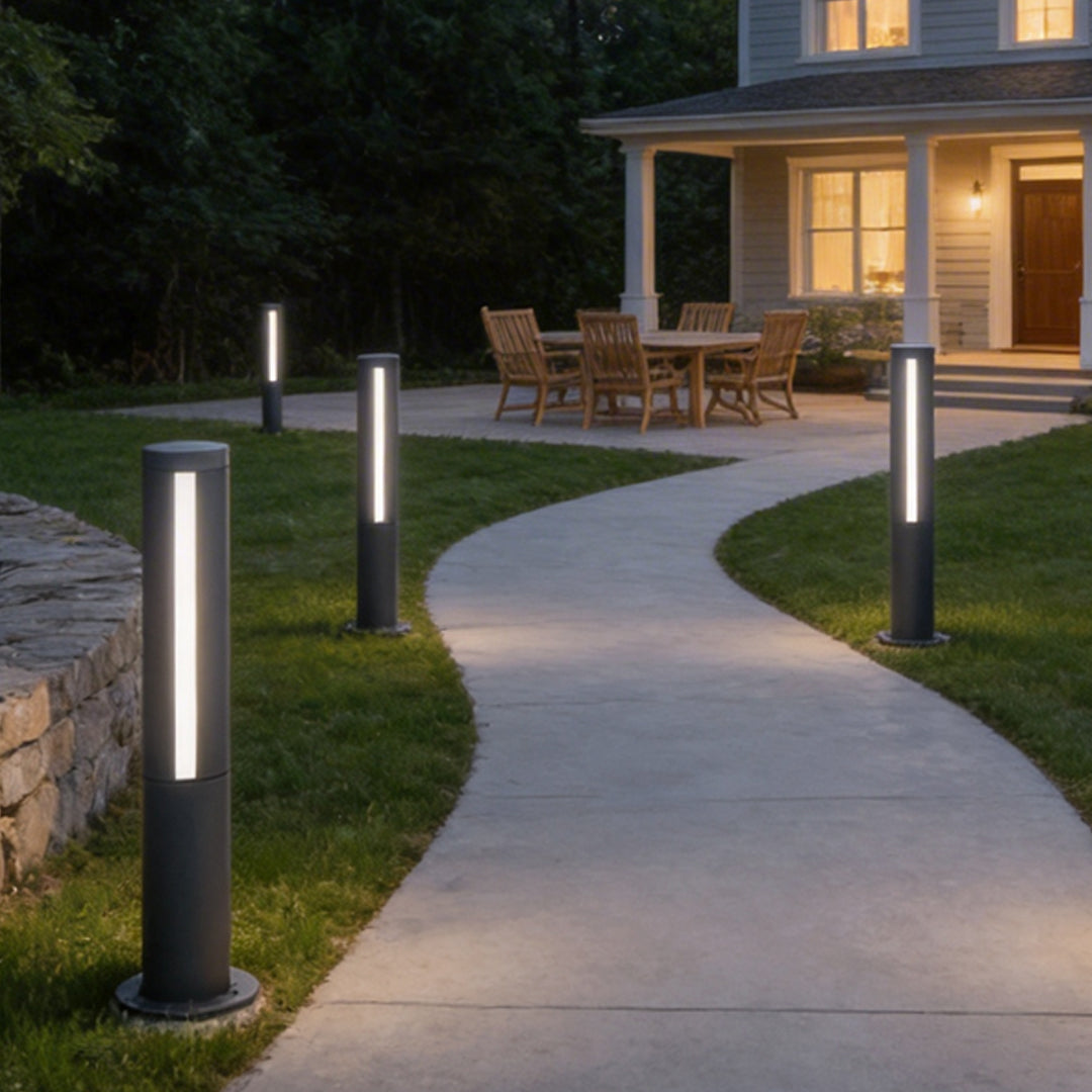 Landscape bollard lamp illuminating a modern garden pathway with elegant linear light.