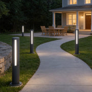 Landscape bollard lamp illuminating a modern garden pathway with elegant linear light.