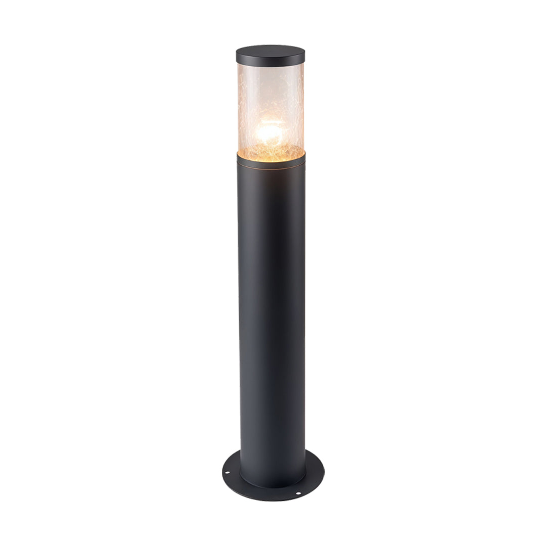 Compact black landscape bollard light fixtures featuring a cylindrical transparent shade and warm glow.