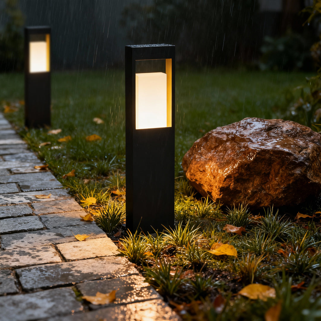 Contemporary landscape bollard lighting highlighting walkway edges with soft warm illumination.