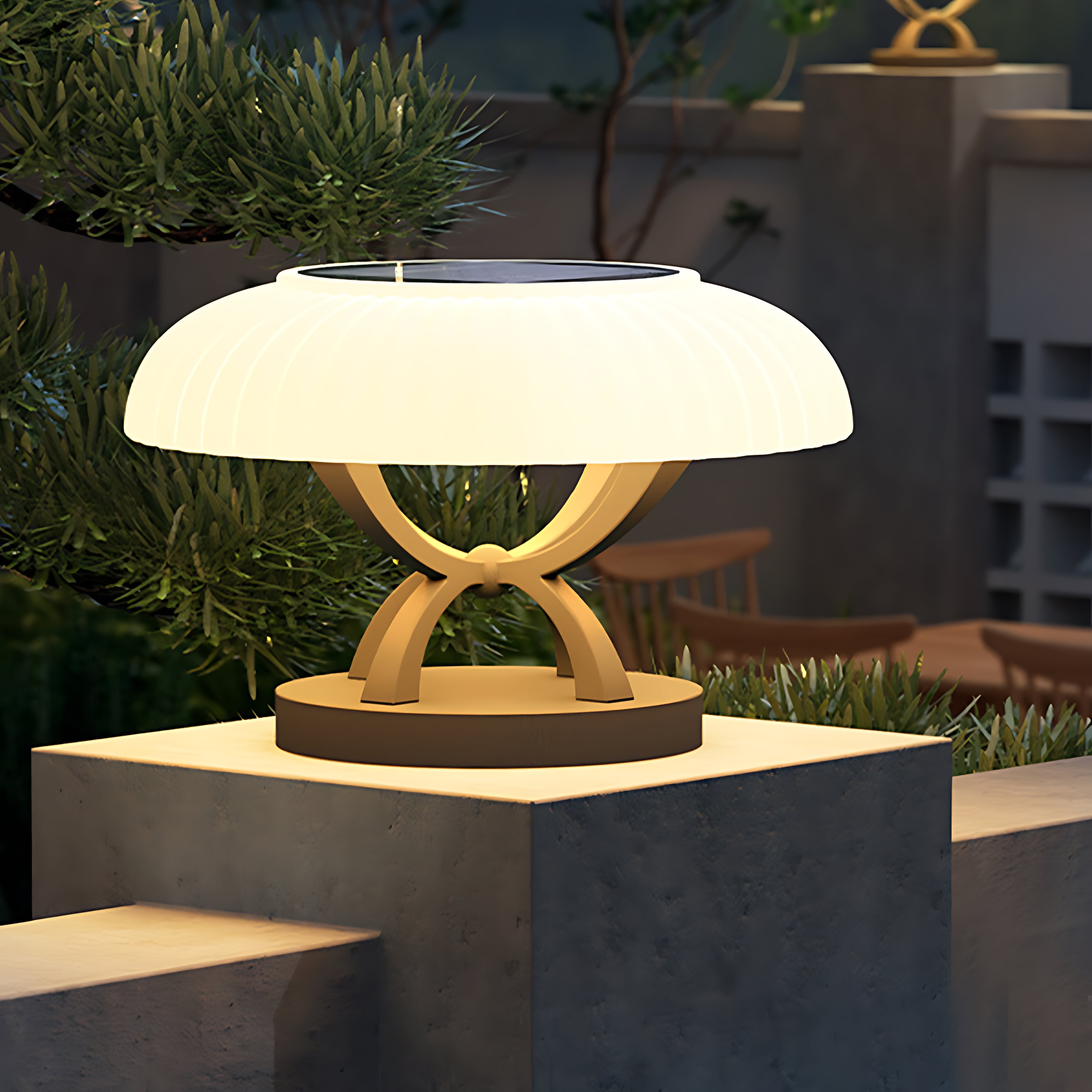 Landscape installation featuring hollow square pillar light with circular LED fixture providing pathway illumination at night