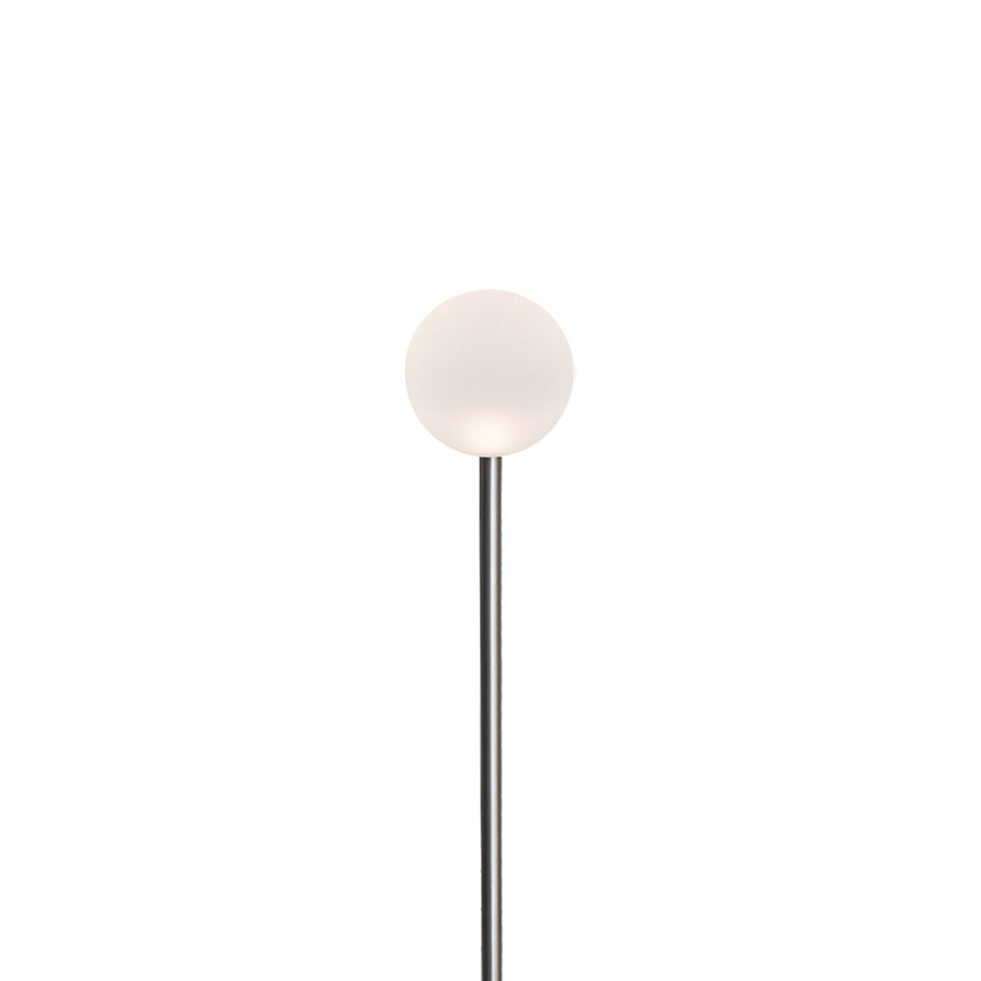 A single minimalist globe pathway light with a slim black pole, ideal for clean and modern landscape lighting pathway designs.