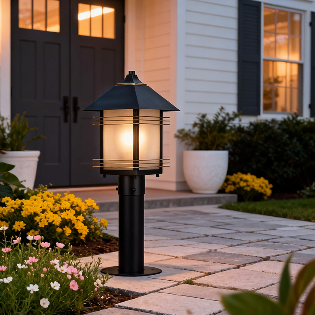 Elegant landscape path lighting fixtures placed beside a paved path, enhancing curb appeal with warm outdoor lighting.