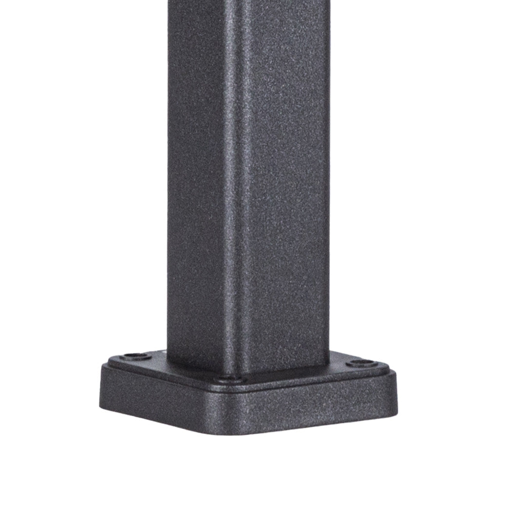 Lantern-style bollard lights providing pathway illumination along curved garden walkway