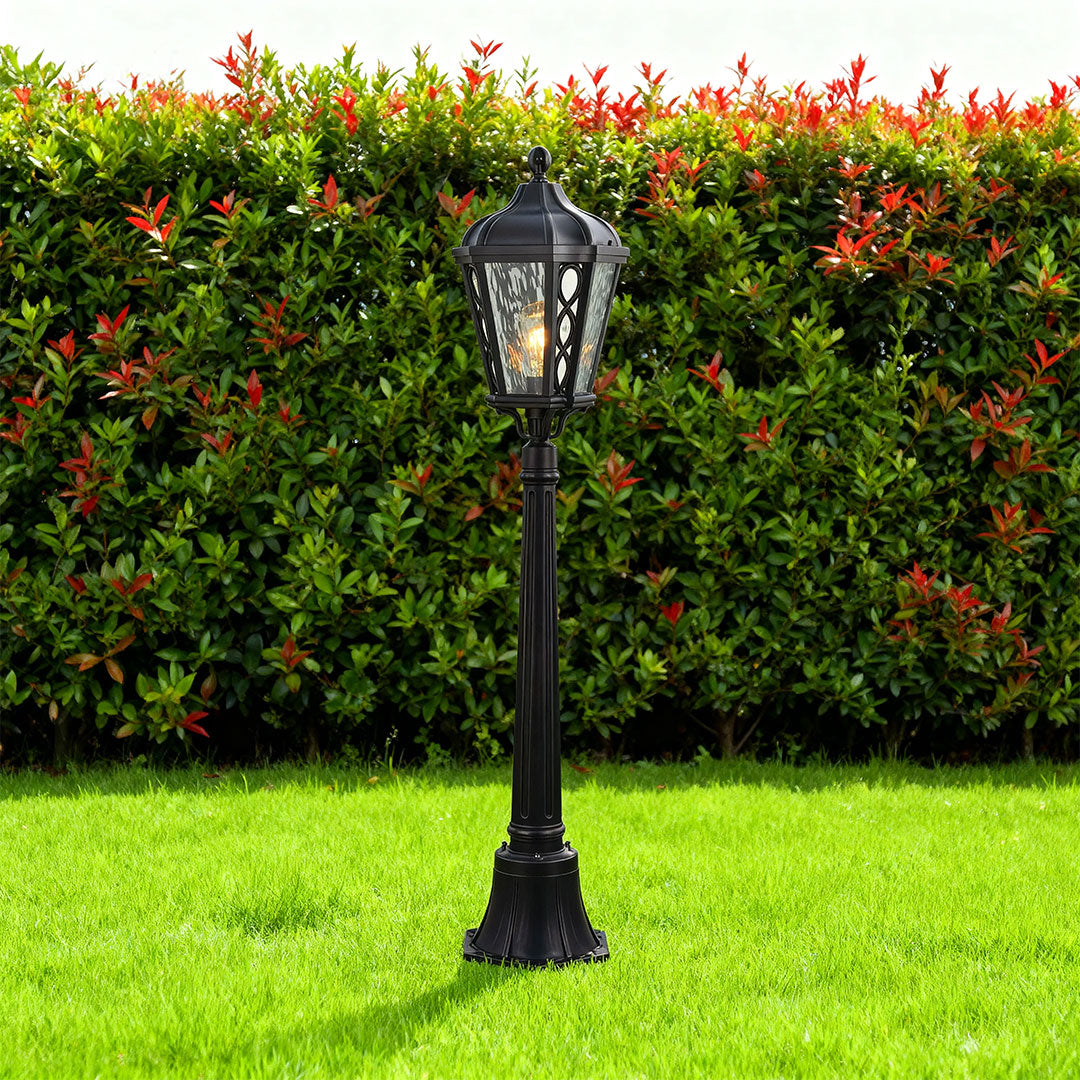 Bollard light in a landscaped garden, elegant and functional outdoor lighting