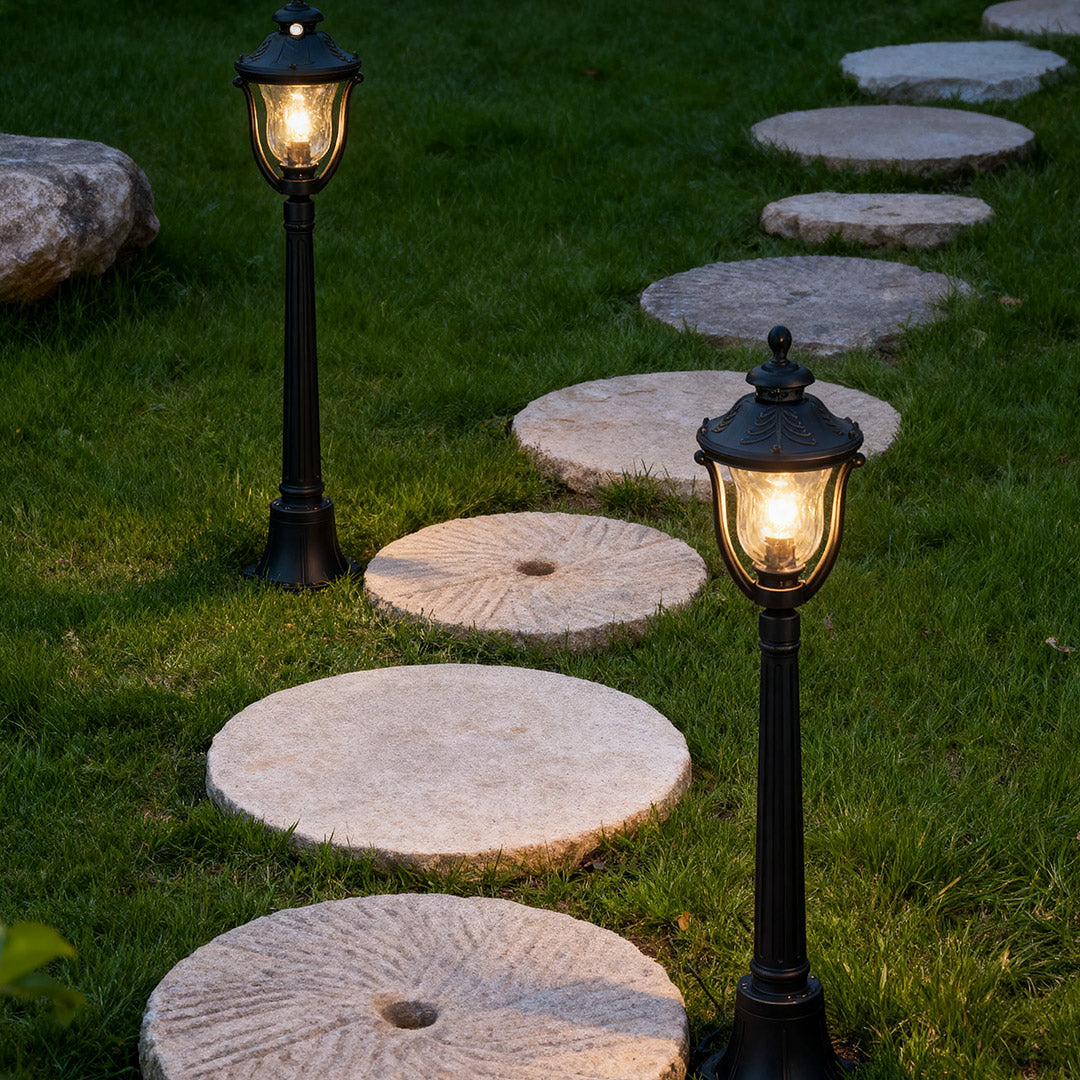 Bollard post light in a landscaped garden, elegant and functional outdoor lighting