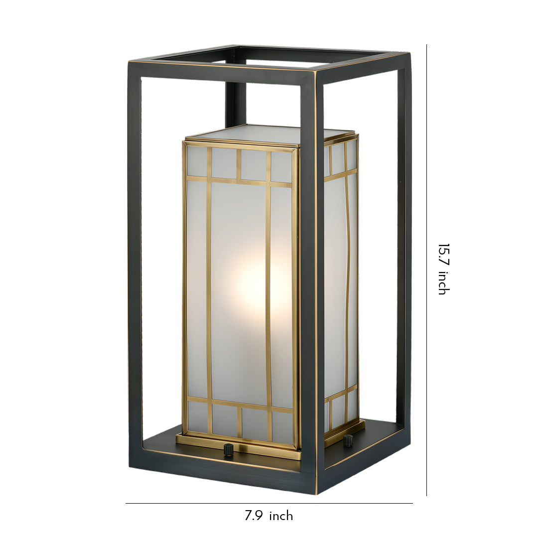Lantern bollard light with a rectangular metal frame and warm inner glow, shown as a standalone outdoor lighting fixture.