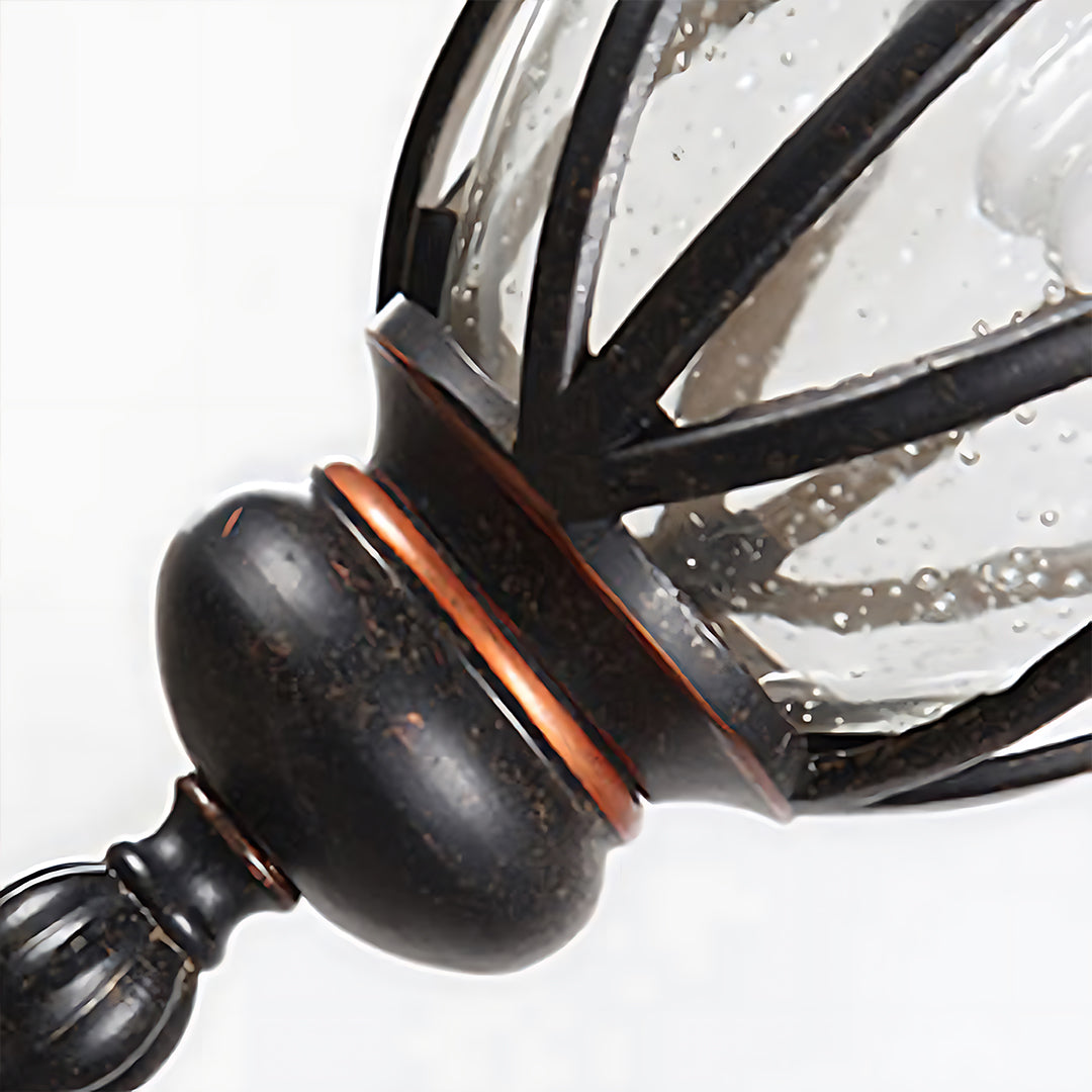 Close-up detail of lantern's decorative metalwork showing craftsmanship and finish quality